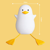 White duck-shaped object with yellow feet and beak on a yellow background, showing measurements.